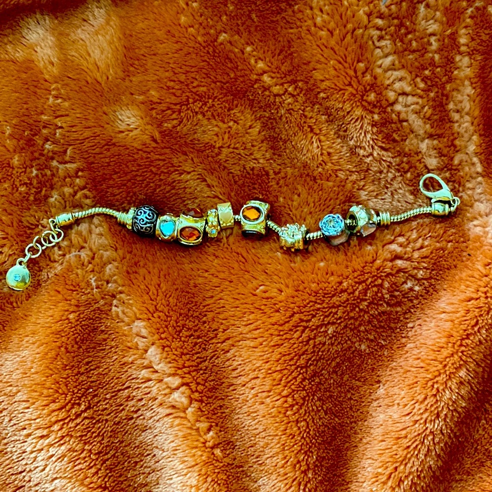 Gold bracelet with charms